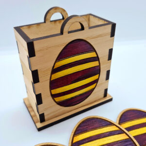 Purple and yellow wooden Easter eggs with wooden basket