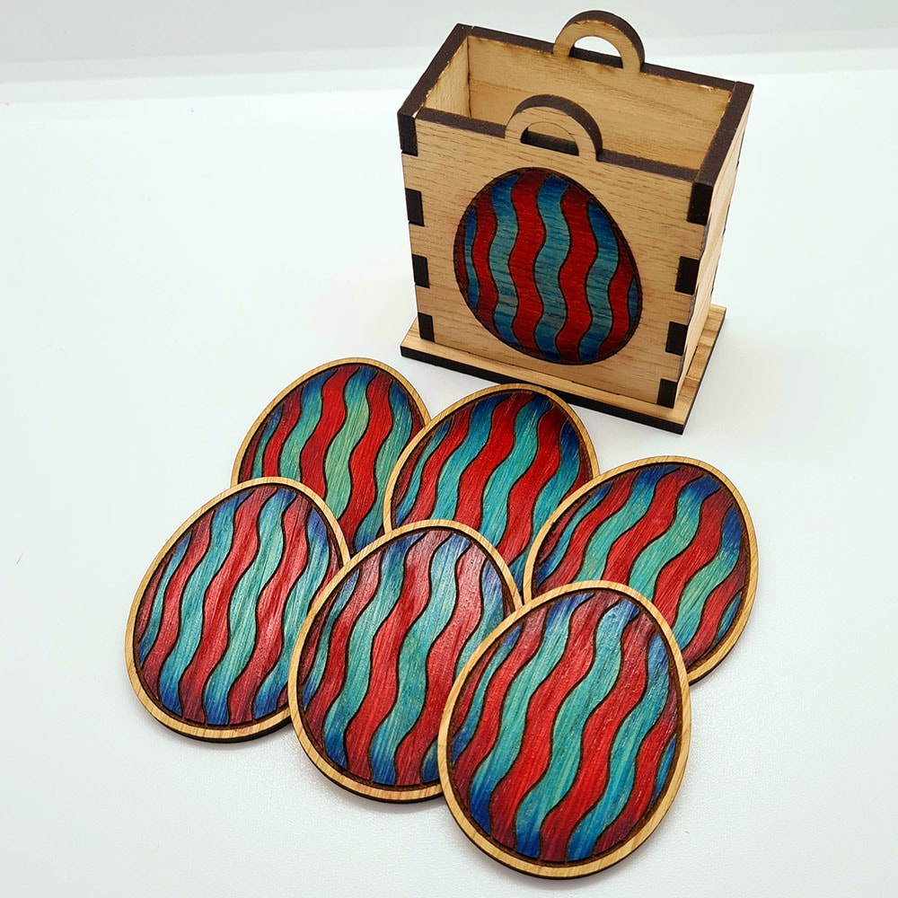 Red and blue wooden Easter eggs with wooden basket